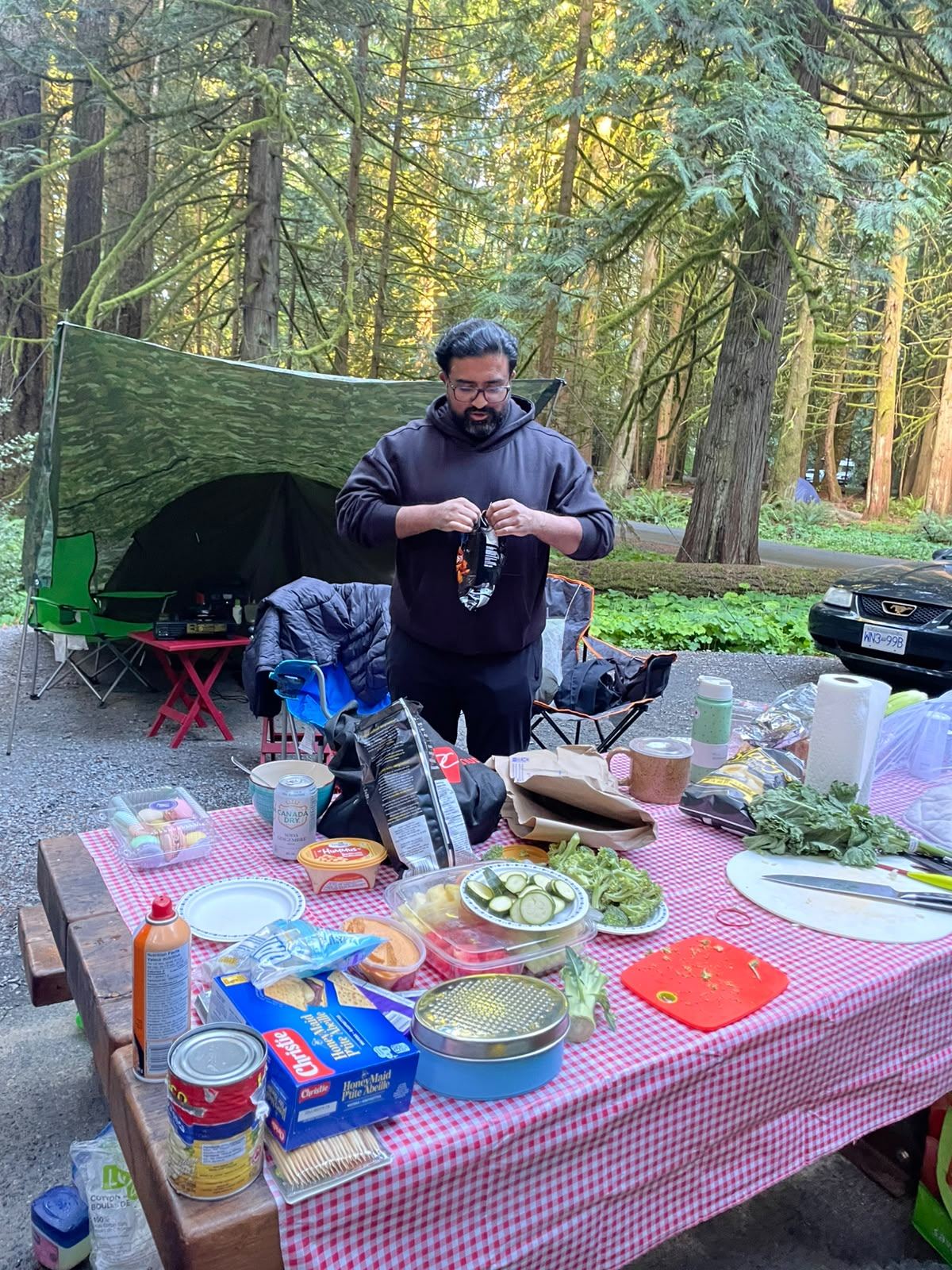 A member prepping ingredients on the camp table